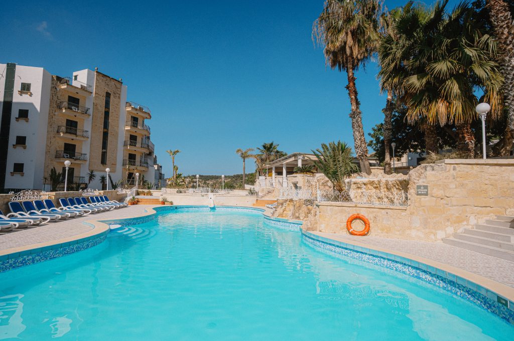 spacious pool area at Xemxija Bay Hotel in Malta