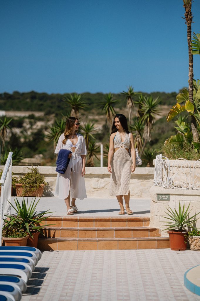 2 women enjoying a relaxed day at Xemxija Bay Hotel in Malta